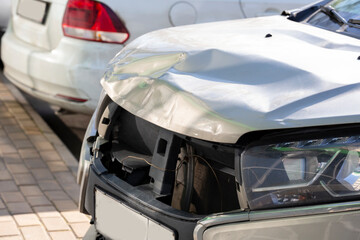 the damaged body of the car is silver gray after the accident