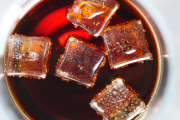  ice dropping in cold drinks glass 