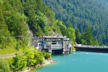 Fototapeta na wymiar Hydro electric power plant on Lago di Cadore lake near Pieve di Cadore in Italy