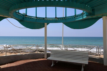 Bench in a city park on the Mediterranean coast