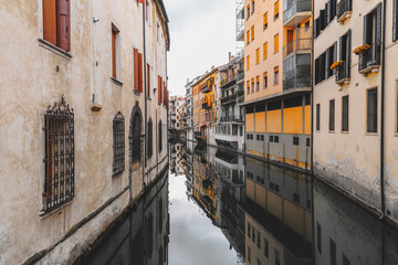 Fototapeta na wymiar Traditional Paduan architecture, buildings by the river Brenta in Padua, Italy