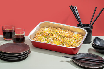 Chahan food tray with drinks and chopsticks isolated on grey background side view