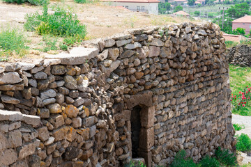 Fototapeta na wymiar Ancient buildings in Cappadocia above the underground city. A masonry building in Turkey.