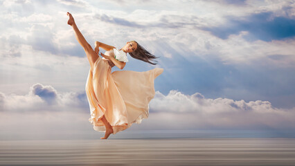 fairy-tale princess in light summer dress with sky background walks towards wind, graceful dancing...