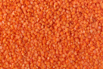 Red lentils pattern as background. Natural organic lentils. Top view. Copy space.