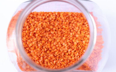 Red lentils in a glass jar.