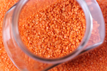Red lentils in a glass jar.