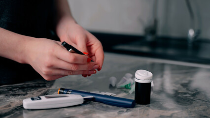 Diabetic patient checks and measures blood glucose level using glucose meter. Test blood sugar level. Treatment and control diabetes. Healthcare and diabetic. Glycemia.