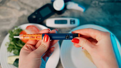 Diabetic devices - glucometer, lancet and insulin. Piece of cake and fresh vegetables. Dilemma of...