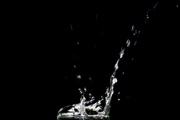 Water splashing on a black background. abstract background of water diffused on black background