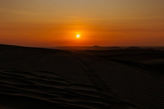 Beautiful view of sunset in the desert of Paracas, Peru