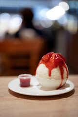 Selective focus of strawberry snowflake ice cream