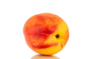One juicy nectarine, close-up, isolated on a white background.