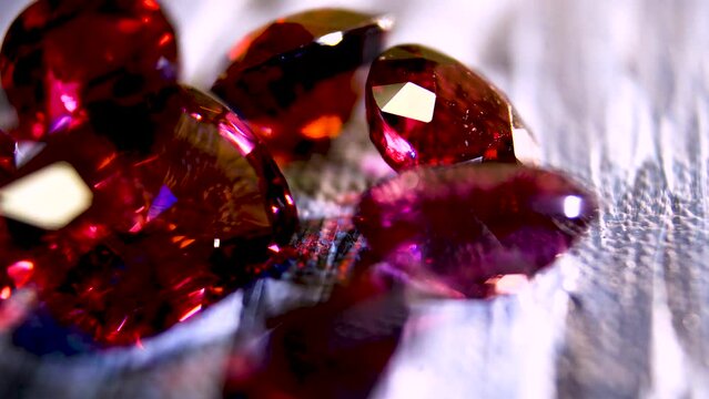 Close-up. Polished gemstone ruby bright red color. Exquisite gemstone ruby.