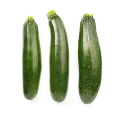 Three zucchini on a white background, green vegetables.