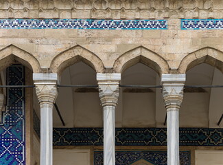 Elements of architectural decorations of buildings, columns and tops, arches and gypsum stucco molding, wall texture and patterns. On the streets in Istanbul, public places. © Kozlik_mozlik