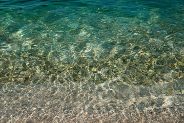 Naklejka na ściany i meble The transparent water surface of the Adriatic Sea. Montenegro Coast