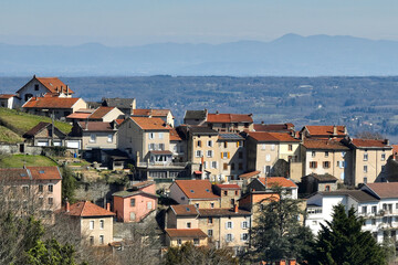 Aerial view of dense historic center of Thiers town in Puy-de-Dome department, Auvergne-Rhone-Alpes region in France. Rooftops of old buildings and narrow streets