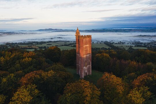 King Alfred tower in South England on autumn morning with sunrise 