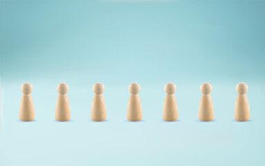 Line of people concept. Group of wooden figures lined up in row. Many wooden peg people in a row.