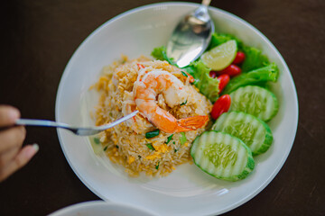Top view of fried rice with shrimp , focus selective shrimp .