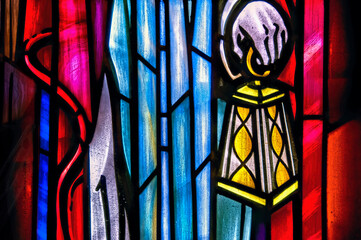 stained glass window, hand holding lantern