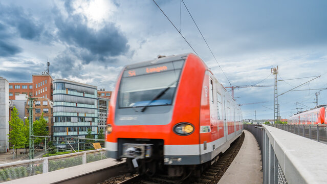 public train in the city under the cloudy sky