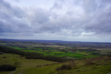 English countryside views over fields with overcast clouds