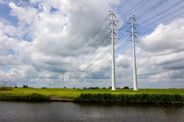 Expansion of the high-voltage grid with many high-voltage pylons to meet the growing demand for...