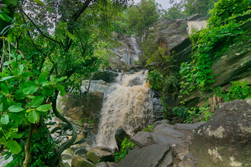 Beautiful Bamni waterfall having full streams of water flowing downhill amongst stones , duriing monsoon due to rain at Ayodhya pahar (hill) - at Purulia, Bengal - formerly West Bengal, India.