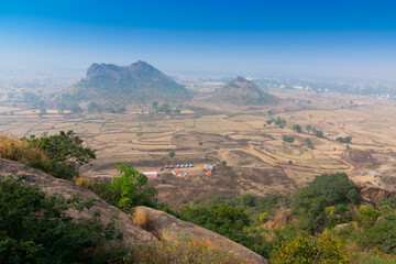Fototapeta na wymiar Joychandi Pahar - mountain - is a hill which is a popular tourist attraction in the Indian state of West Bengal in Purulia district. View of Purulia from the top of the hill in daytime with blue sky.