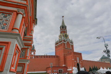 The Spasskaya Tower of the Moscow Kremlin on Red Square, with huge clock and five stars on top - The five-pointed red star has often served as a symbol of communism in Russia.