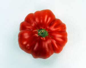 Tomato isolated on white. Ripe red fresh appetizing tomato. Harvest vegetables, Spanish tomatoes. Raf variety, organic vegetables