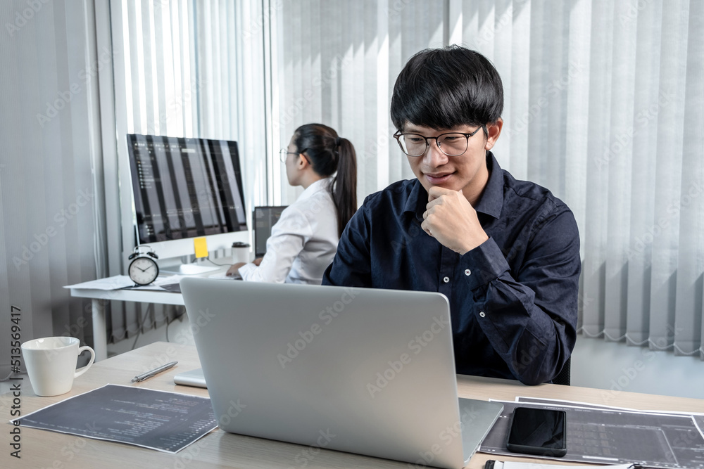 Aufkleber team of two professional programmers working on website projects in software development on the desk