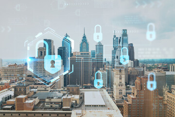 Aerial panorama city view of Philadelphia financial downtown at day time, Pennsylvania, USA. Glowing Padlock hologram. The concept of cyber security to protect companies confidential information