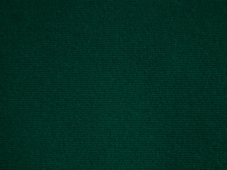 Dark green old velvet fabric texture used as background. Empty green fabric background of soft and smooth textile material. There is space for text..