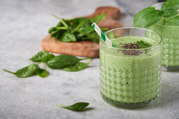 Spinach smoothie healthy green. Vegan smoothie or milkshake from spinach, banana and chia seeds on...