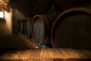Wine barrels in a old wine cellar - 513577475