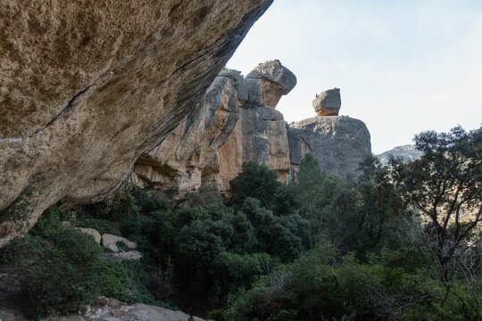 Beautiful view of rocks with trees on a sunny day in Margalef, Spain