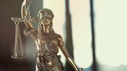 Legal and law concept statue of Lady Justice on blurred background