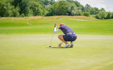 Golfer sport course golf ball fairway. People lifestyle woman playing game golf tee of on the green grass. Professional golf  female player game shot in summer. Healthy and Sport outdoor