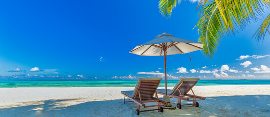 Amazing vacation beach. Chairs on the sandy beach near the sea. Summer romantic holiday tourism....