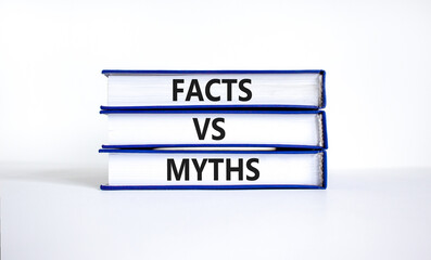 Facts vs myths symbol. Concept words Facts vs myths on books on a beautiful white table white...
