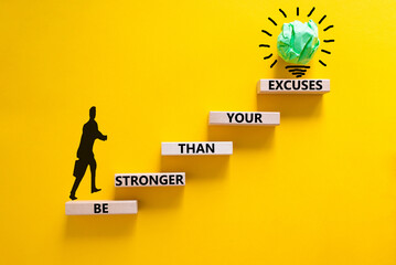Be stronger symbol. Concept words Be stronger than your excuses on wooden blocks on a beautiful...