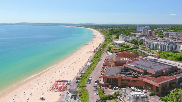 Bournemouth, UK: Aerial view of city in England, wide beach, blue waters of Atlantic Ocean in seaside resort in summer, sunny day with clear blue sky - landscape panorama of United Kingdom from above