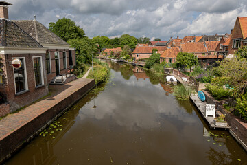 Fototapeta na wymiar The village of Winsum in the province of Groningen, with beautiful canals and old buildings, elected as one of the most beautiful villages in the Netherlands