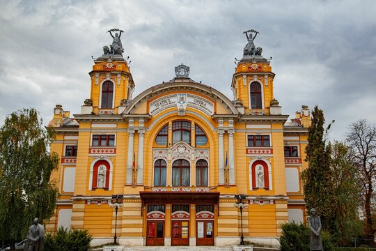 Scenic view of the National Theater Lucian Blaga against a cloudy sky in Cluj-Napoca, Romania