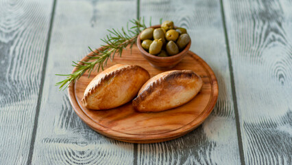 La salteña es un tipo de empanada de origen boliviano , ​ comido como una merienda jugosa y rellena con carne, pollo u otras carnes, huevo duro, especias, y otros ingredientes, cocida al horno