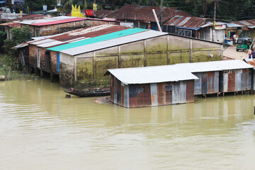 Flooded markets and houses at sylhet, bangladesh due to heavy rainfall. climate change and global...