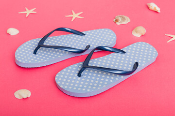 Beach accessories. Flip flops and starfish on colored background. Top view Mock up with copy space